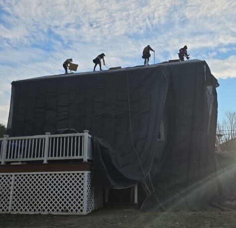 jasmor roofing crew on installation day - image of roof and home siding well protected